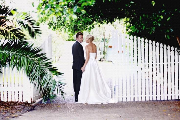 Twilight Garden Reception with banquet tables under fairy lights